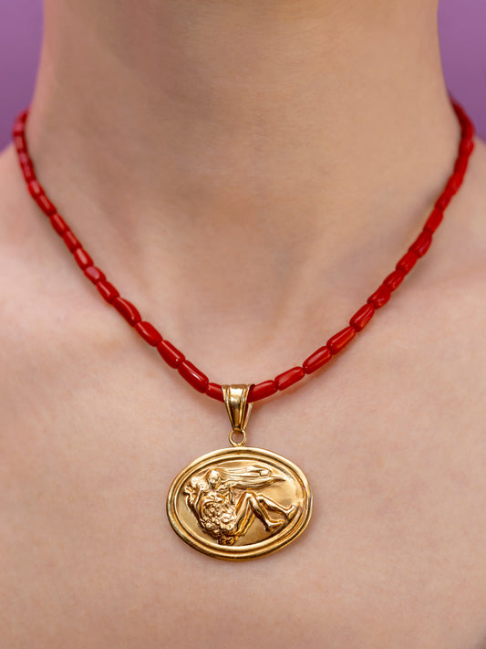 Pied a Terre 14k Vintage Italian figural pendant on 16” hand strung natural coral strand with chunky 14k clasp
